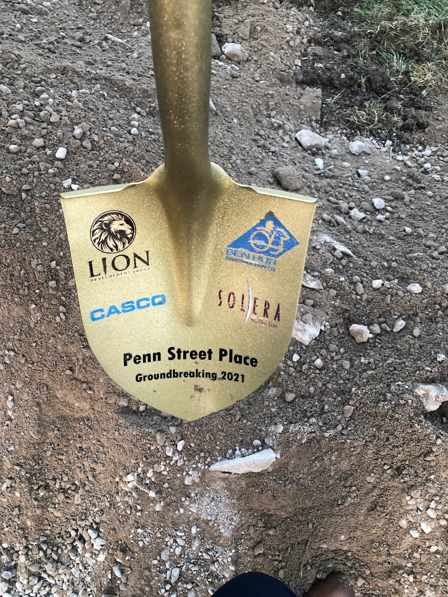 Penn Street Place Groundbreaking shovel with each company logo