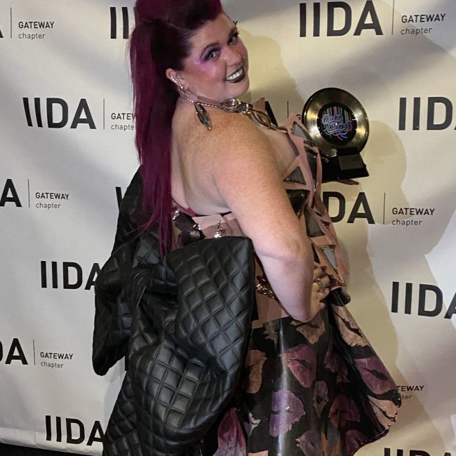 Katie Hepting showing off the back of her dress on the IIDA red carpet